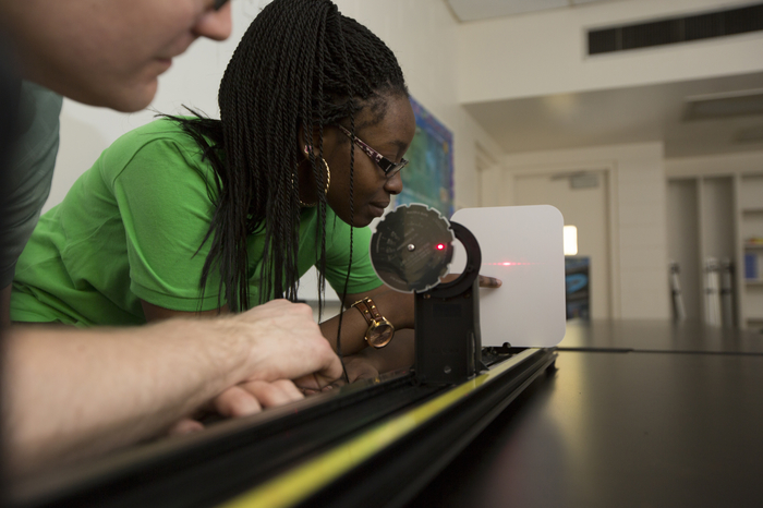 Student working with a laser