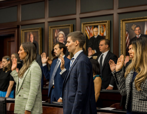 A group of law students taking the oath.