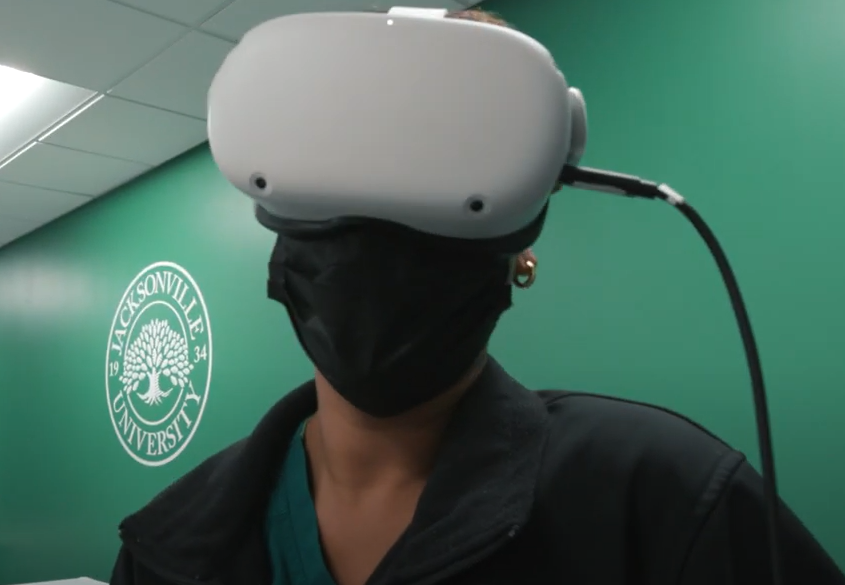 Student experiences a VR simulation.