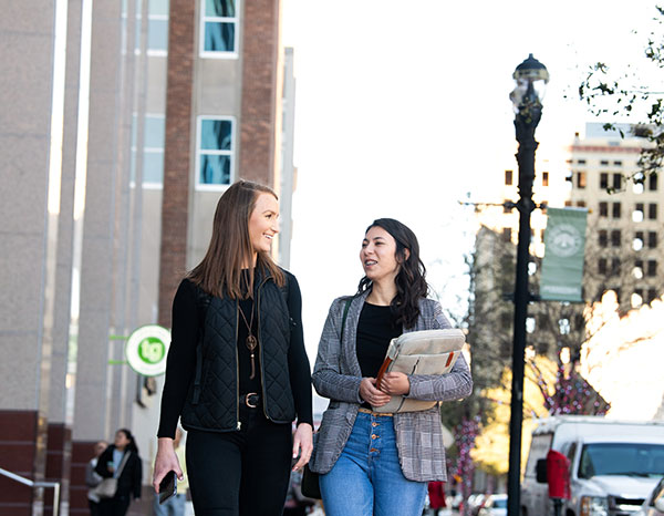 Two students walk through downtown Jacksonville.