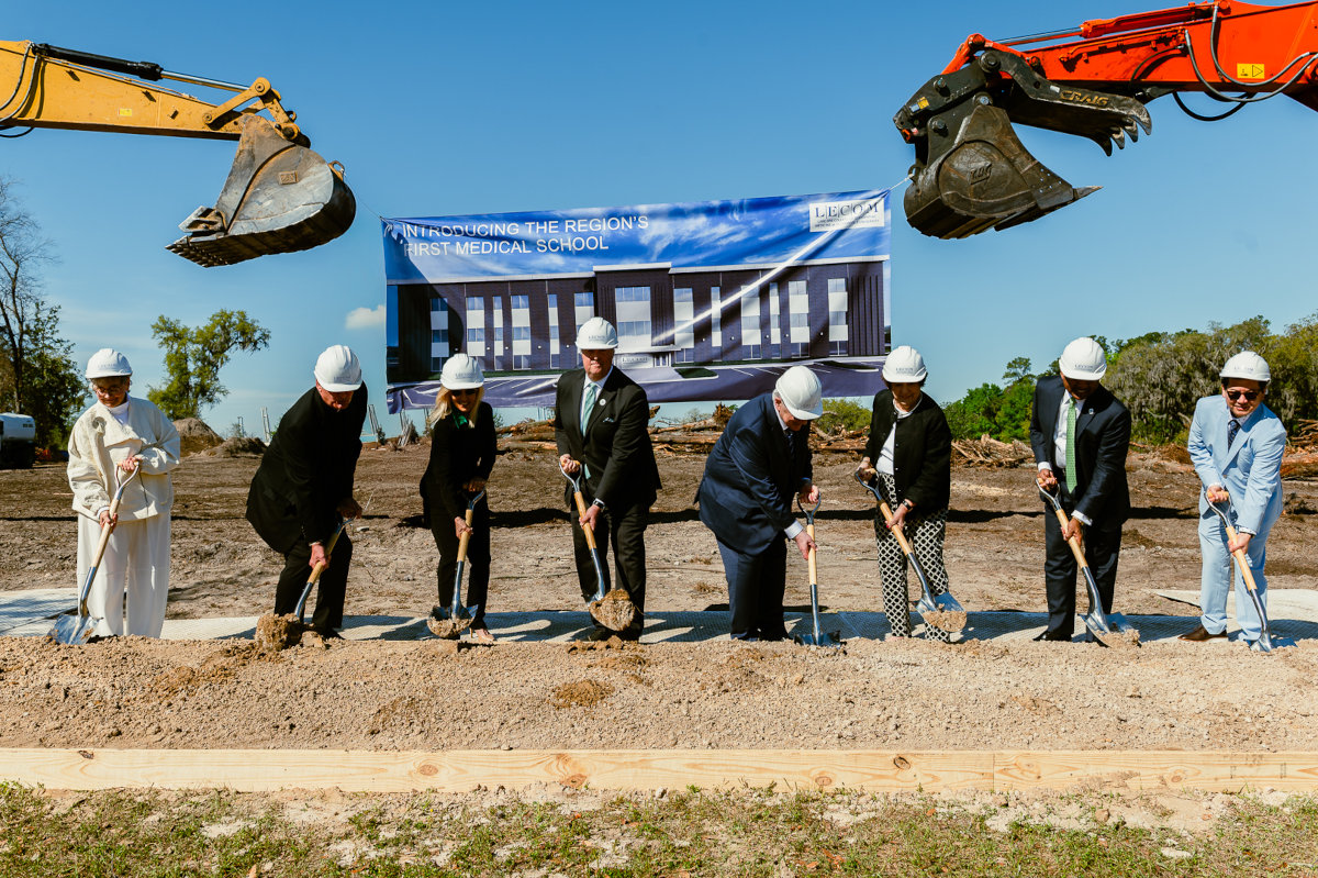 President Cost and LECOM Executives breaking ground for medical school building.