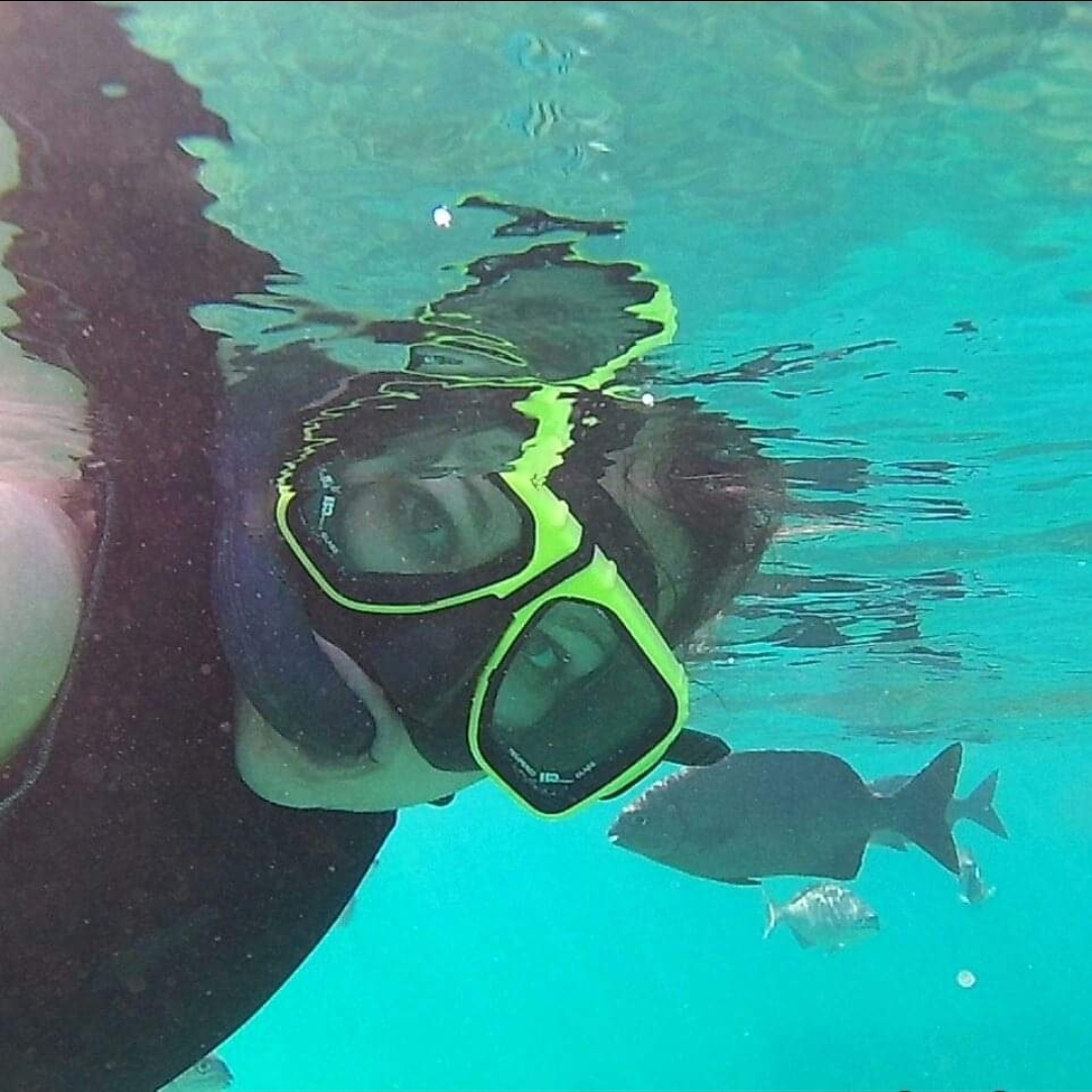 girl underwater in a mask and gear 
