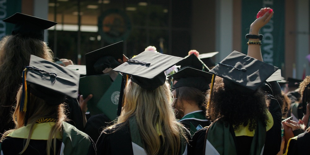 Students in caps and gowns at Commencement