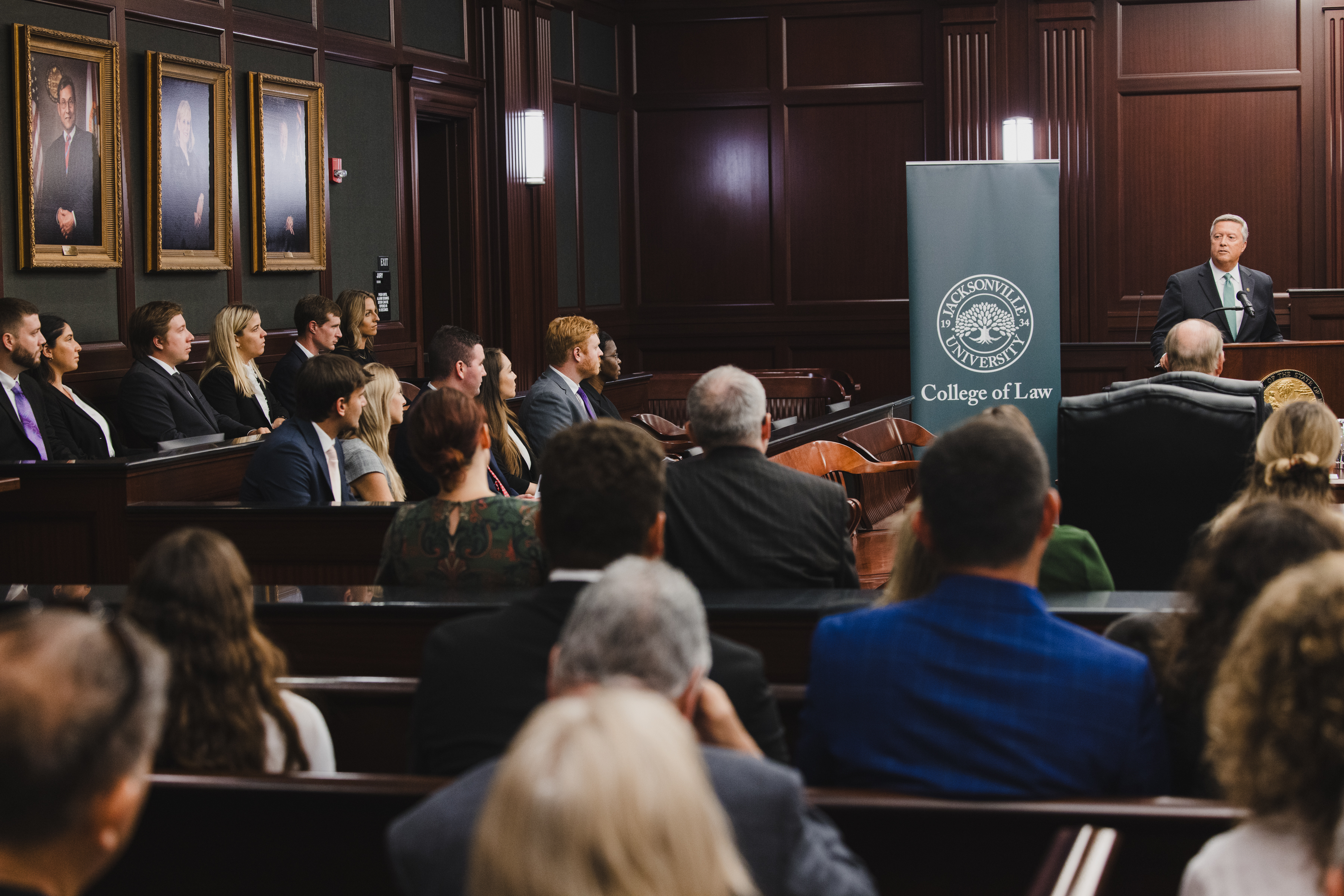 President Cost speaking to law students