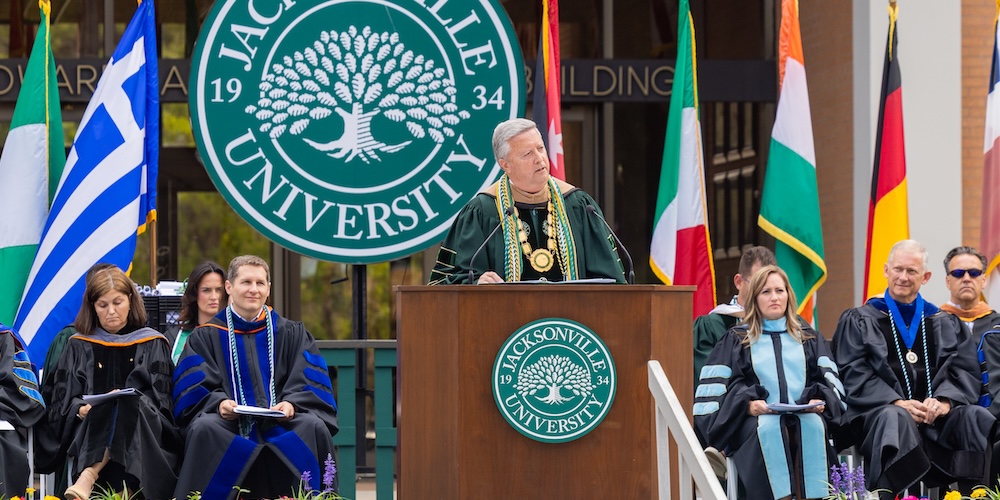 President Tim Cost on stage at Graduation
