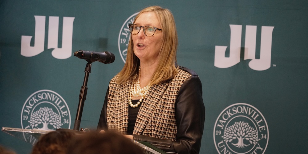 Dr. Lisa Sutherland at podium