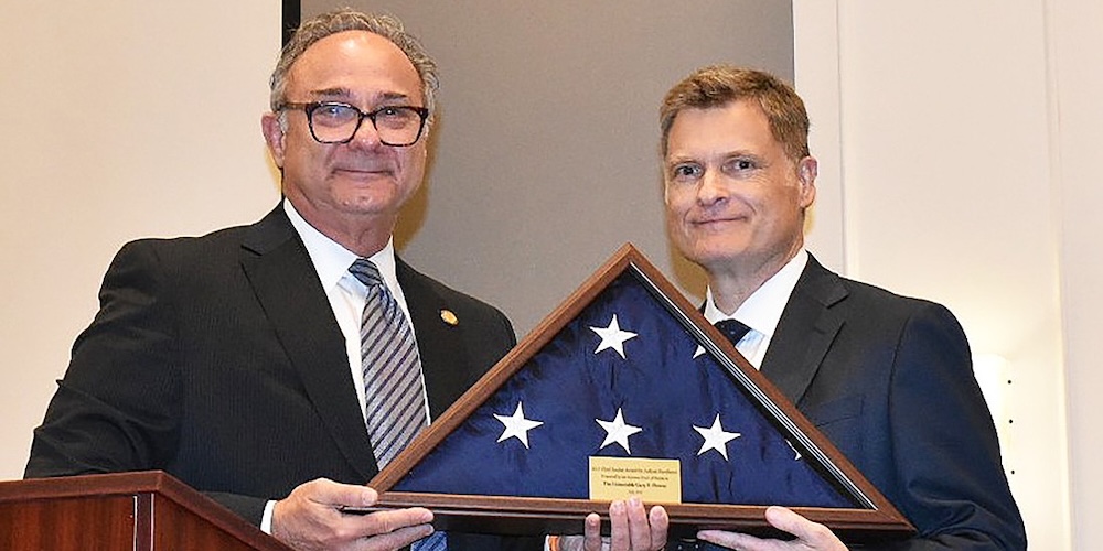 Duval County Court Judge Gary P. Flower and Chief Justice Carlos Muñiz