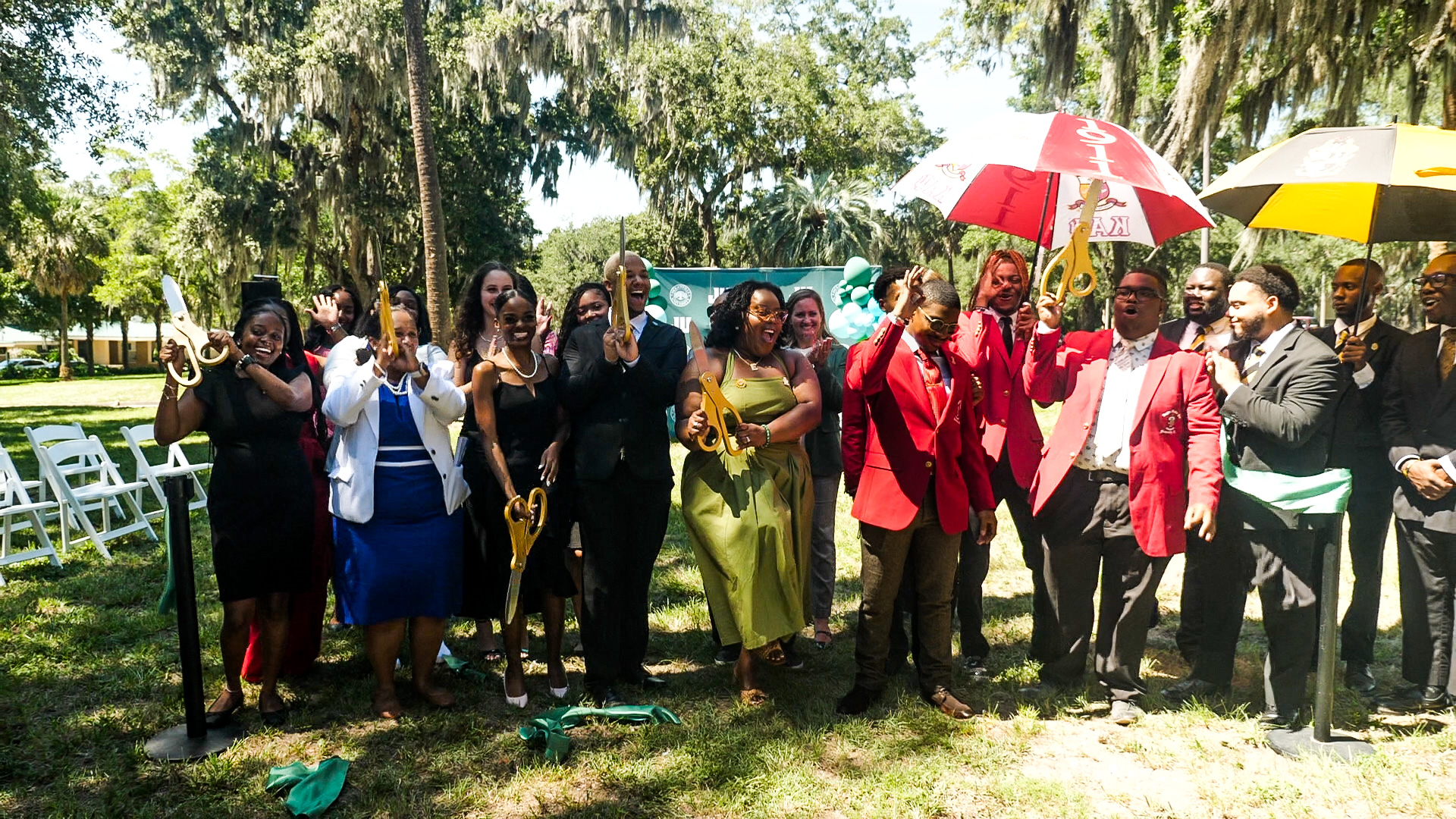 Students celebrate after cutting plaza ribbon