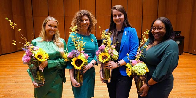 The 2022 Woman of the Year winners pose with their flowers.