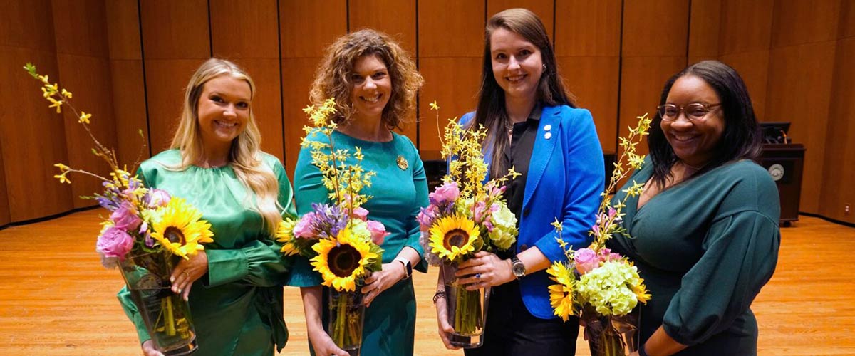 The 2022 Woman of the Year winners pose with their flowers.