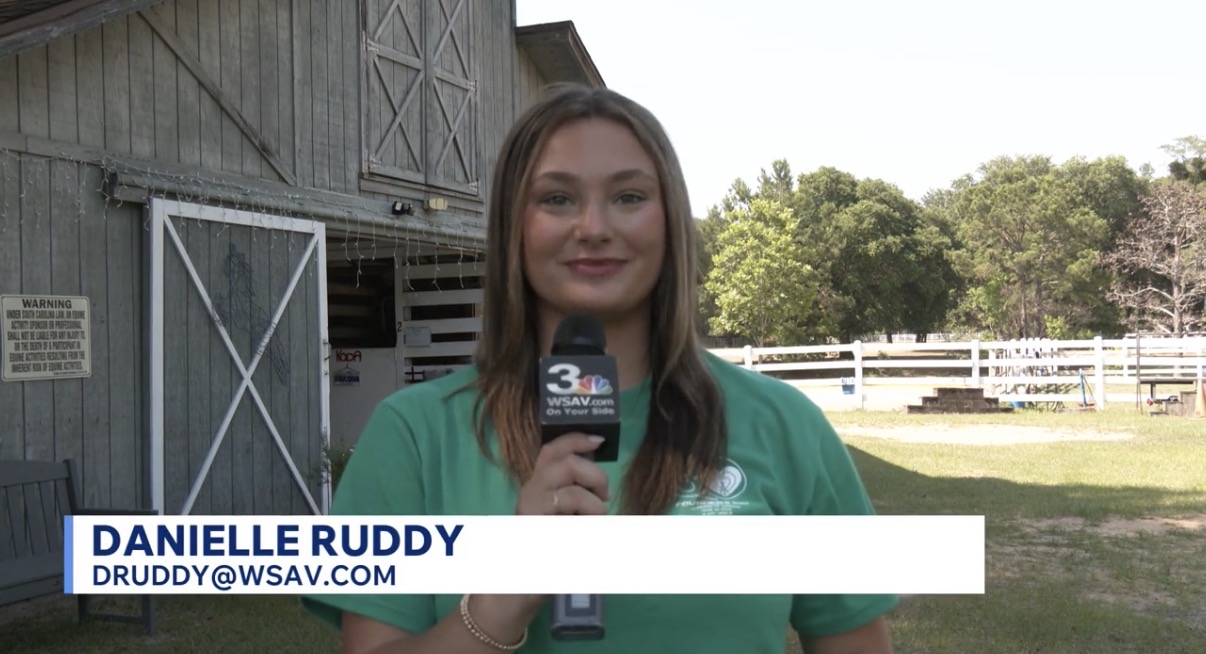 Danielle Ruddy working as a reporter in Savannah