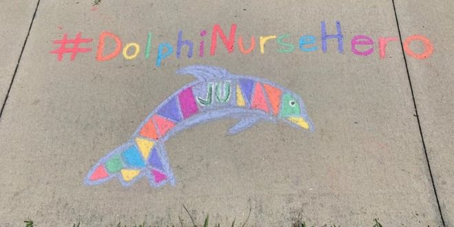 Photo of a dolphin drawing on the sidewalk with chalk and #DolphinNurseHero above it.