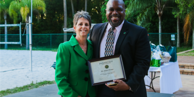 Dr. Demps (right) is recognized with the 2022-2023 Professor of the Year award. Photo by Taylor Sloan.