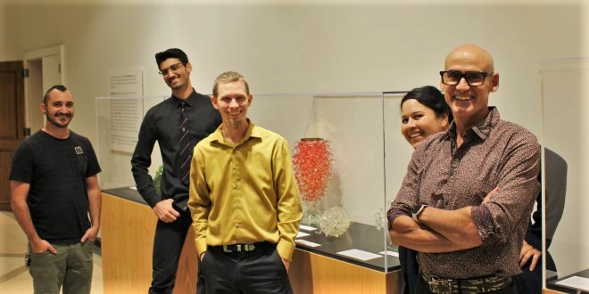 JU glassblowing students posing for a photo. 
