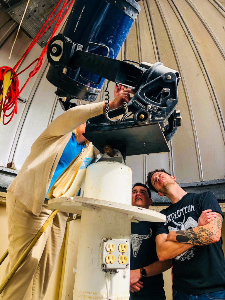 JU student Kenneth Huffman (on right) and others prepare for Jan. 20 event inside JU’s Observatory.
