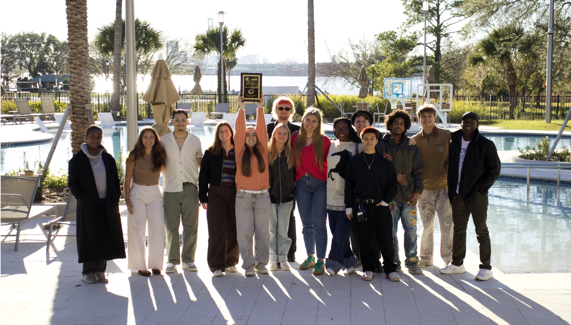 Students holding award with Agija Elerte Students holding award with Agija Elerte
