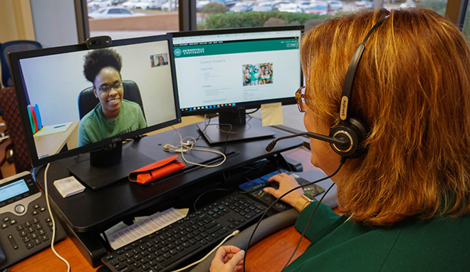 A student success worker on a video call with a student.