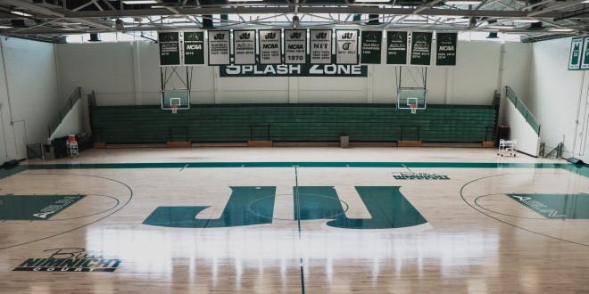 Photo of the basketball court inside Swisher Gymnasium. 