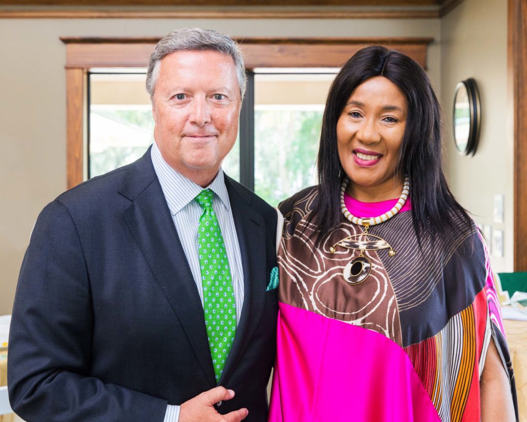 Dr. Makaziwe Mandela and President Tim Cost '81 pose for a photo together at the River House