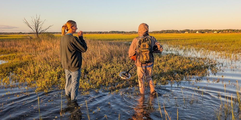 Students surveying a Northeast Florida marsh