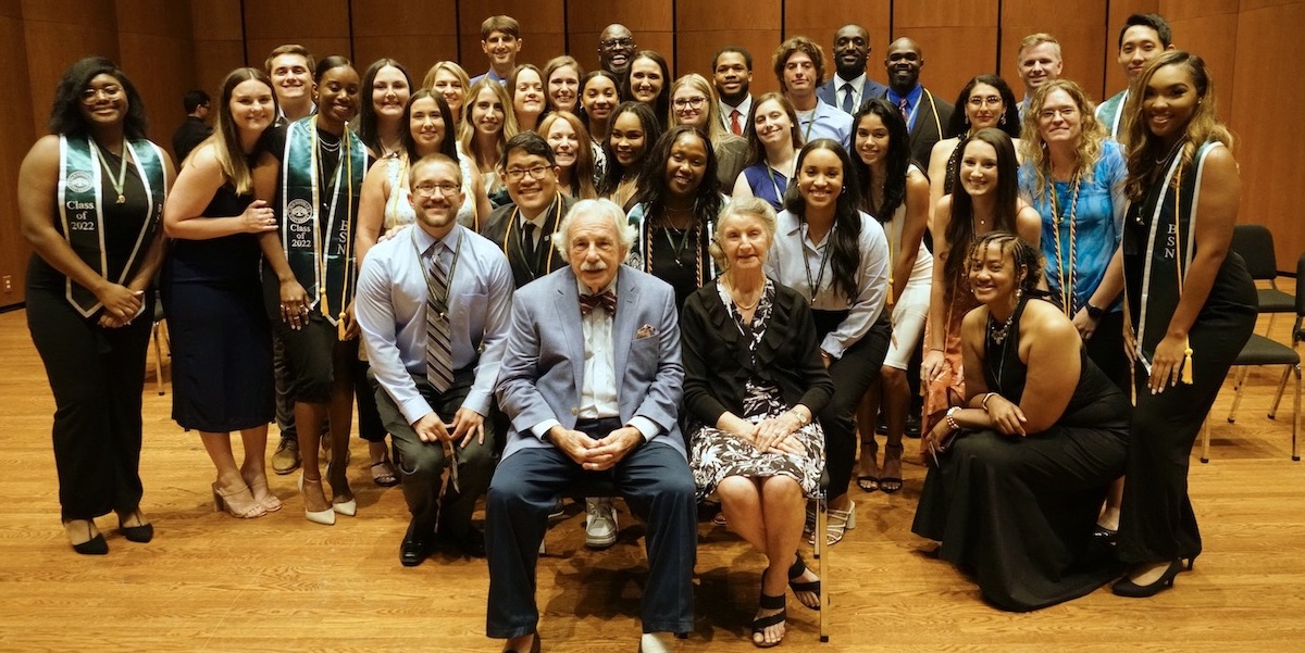 The Keigwins pose for a photo with the inaugural 12-month ABSN graduating class.