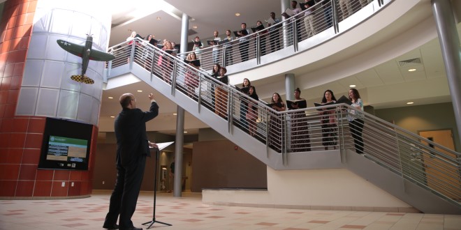 Dr. Timothy Snyder conducting Linda Berry Stein College of Fine Arts vocal students in an impromptu campus concert, A Little Lunch Music at the Davis College of Business.