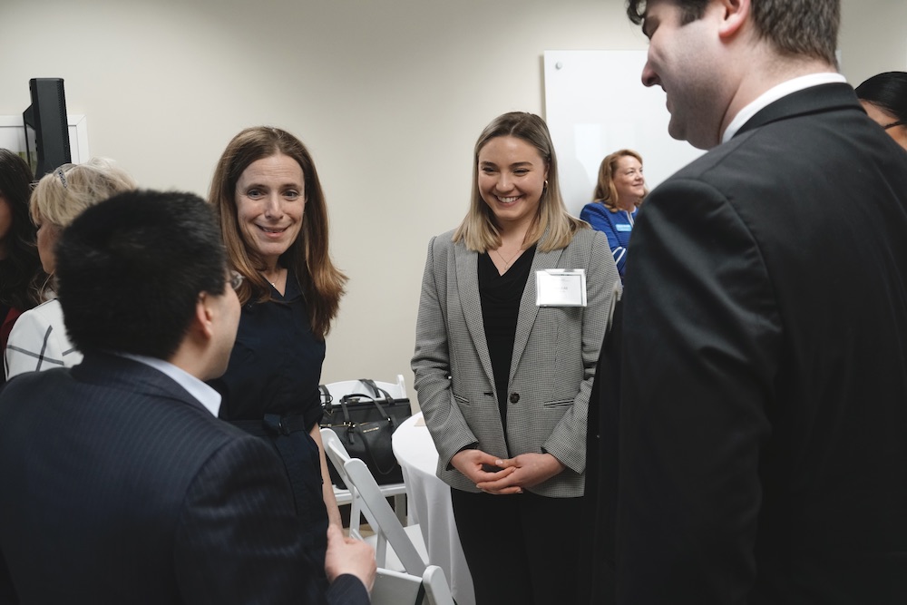 law students speak with panelists