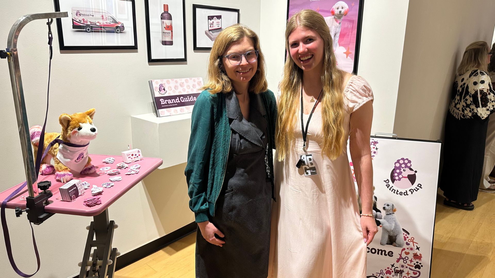 Skye Tiedemann with her senior thesis and professor Katie Webber