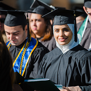 A student wearing a hijab at commencement. Click for international student instructions.