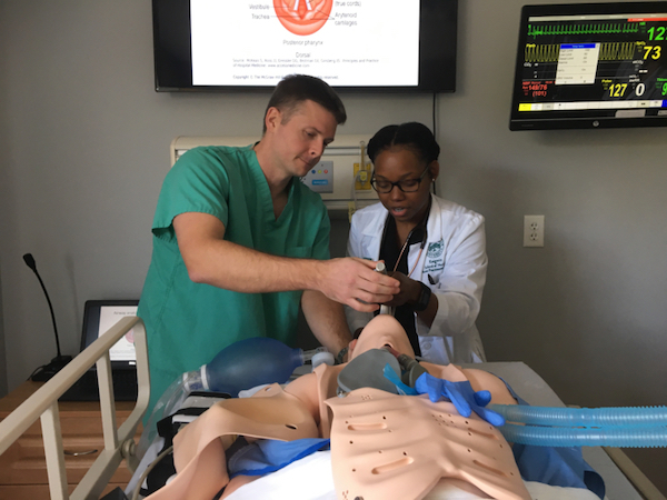 Nursing students learning in the lab.