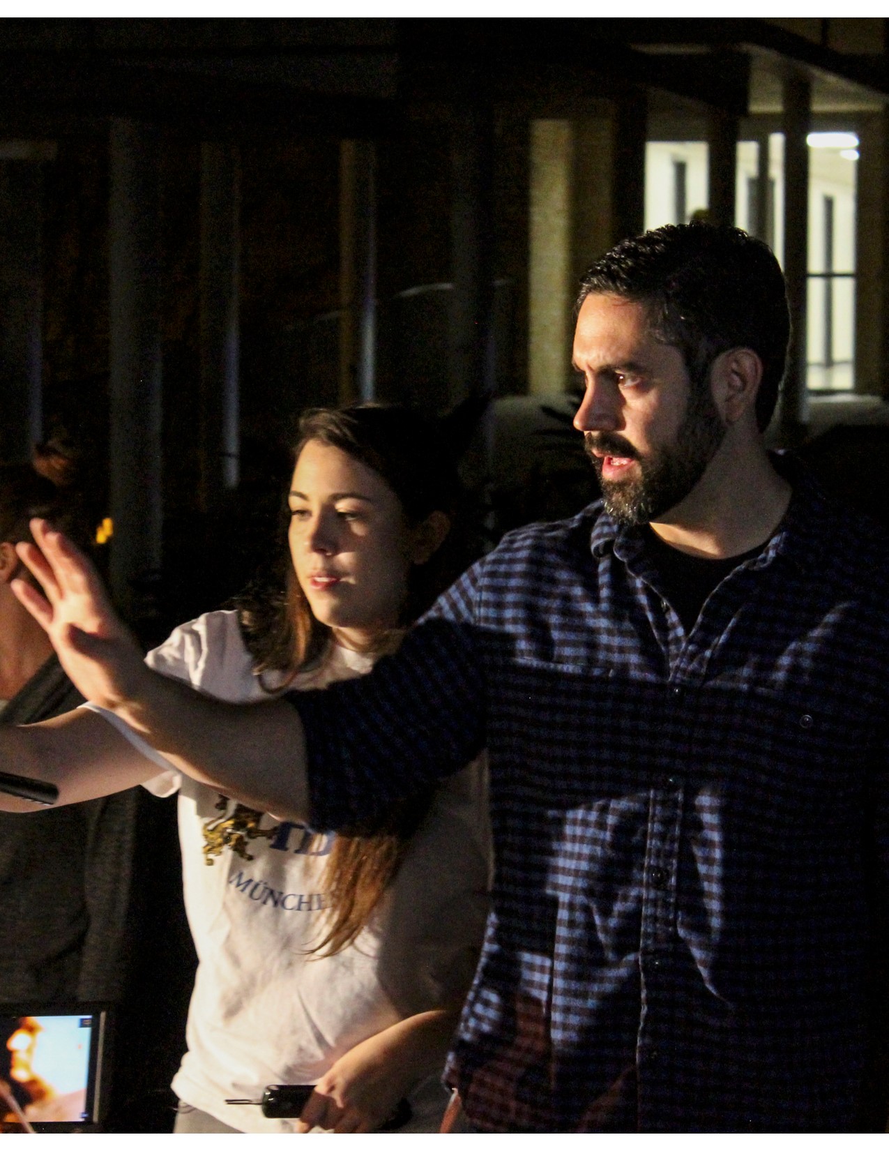 Alex Willemin directing a student on the set of a movie