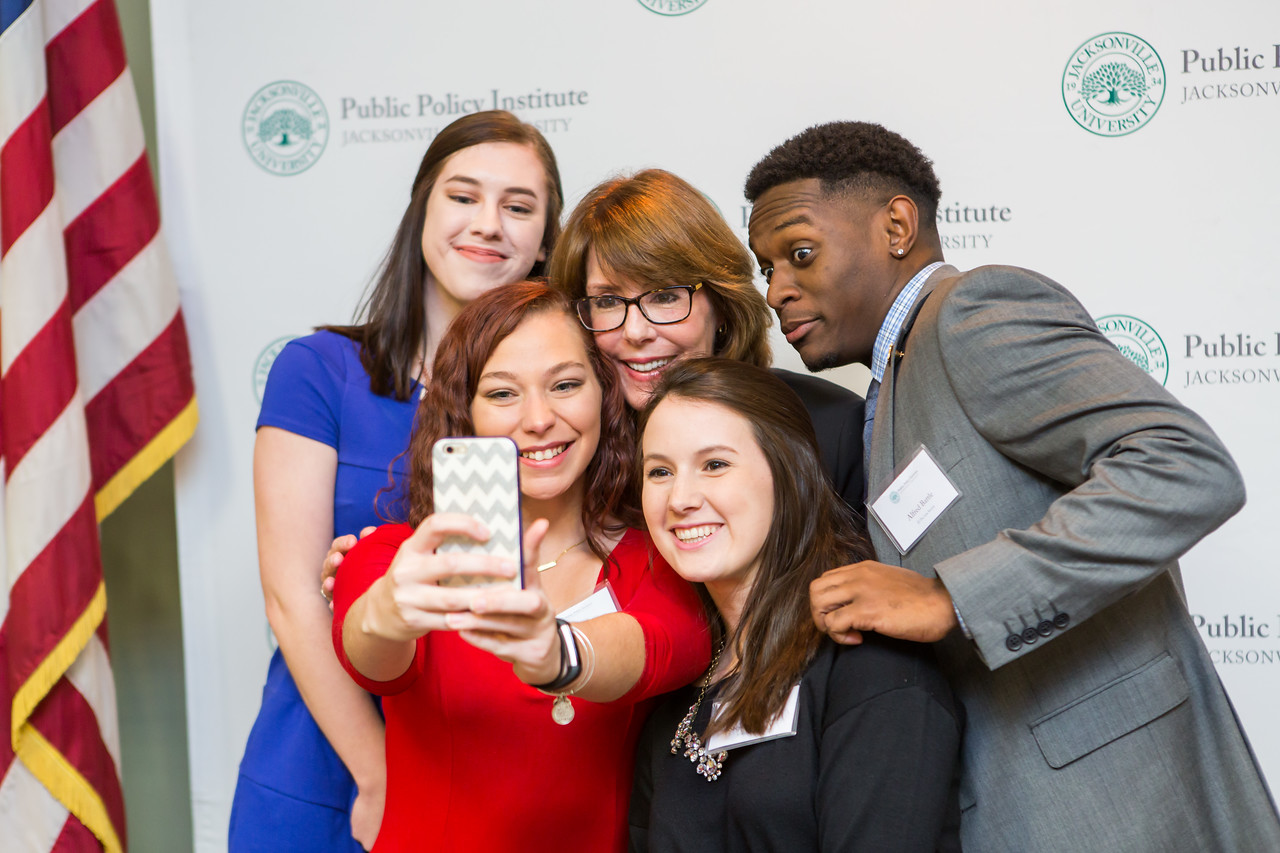 Public policy students taking a group photo.