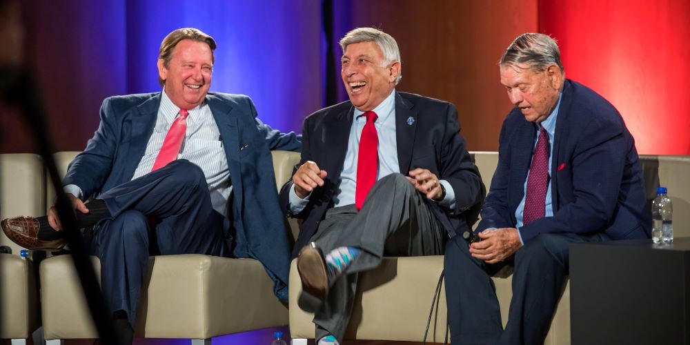 left to right: former mayors John Delaney, Tommy Hazouri, and Jake Godbold laughing on stage