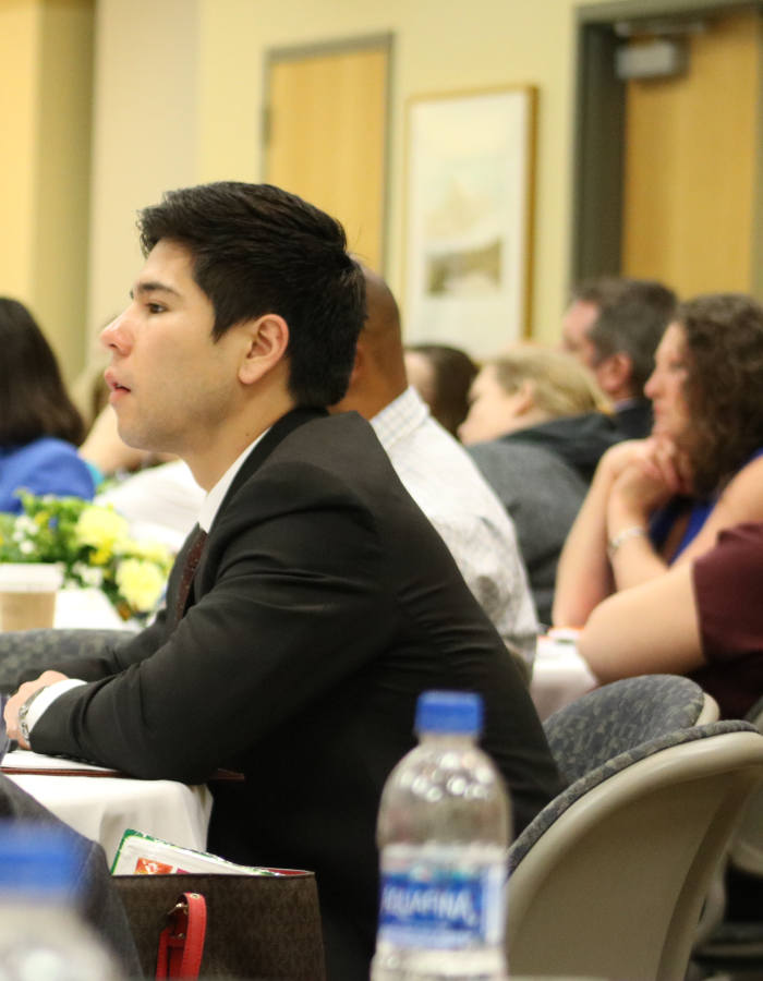 People seated at a conference room