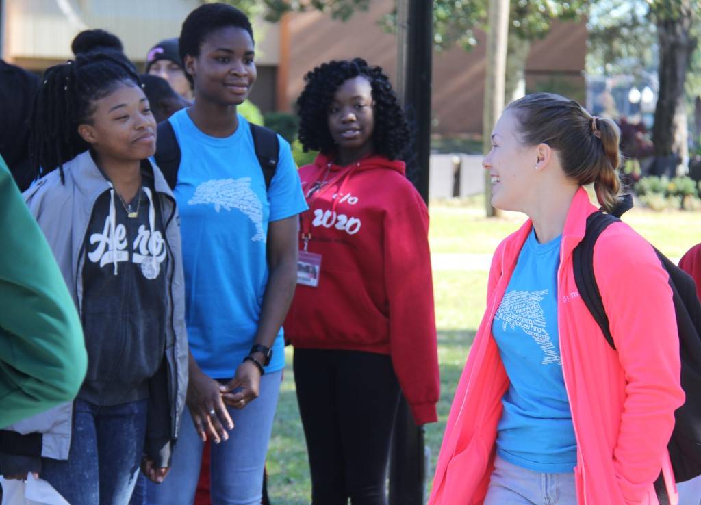 Sociology students with their school-age mentees during a campus tour