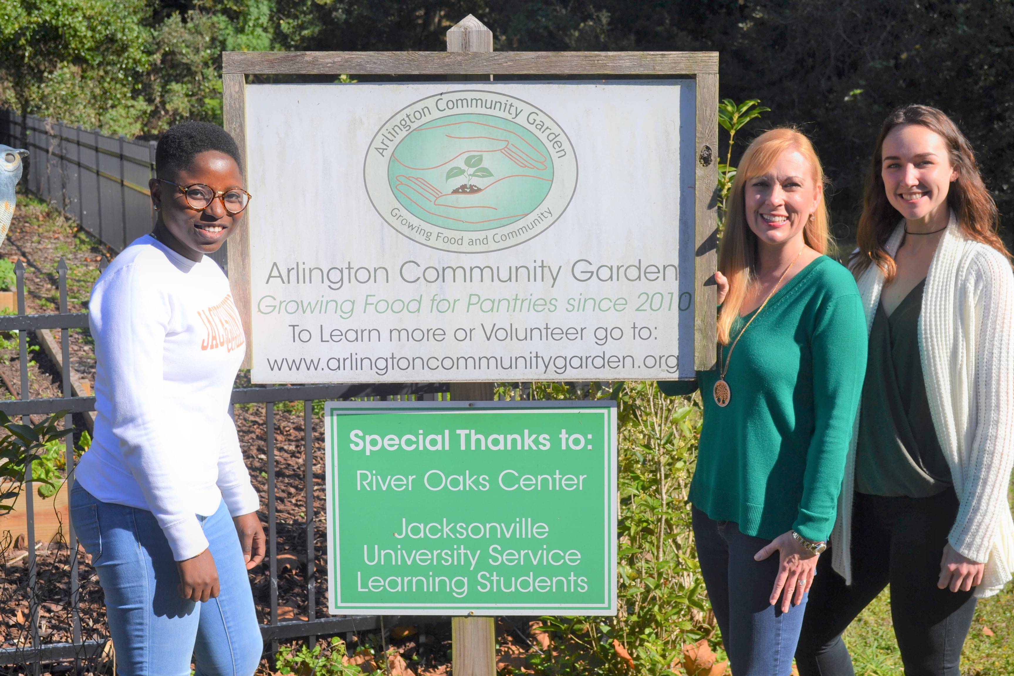 Students and Dr. Laura Atkins during a service-learning project at Arlington Community Garden