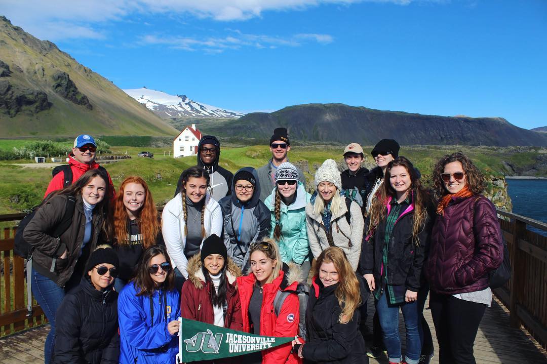 Group trip photo of students and teacher 