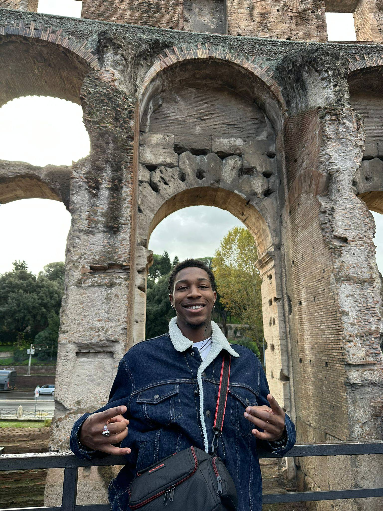 Male student in front of ancient structure