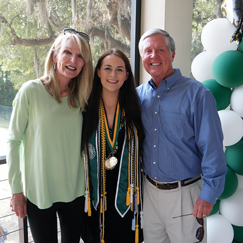 Savannah Bates at graduation with Denny and Robin Doyle