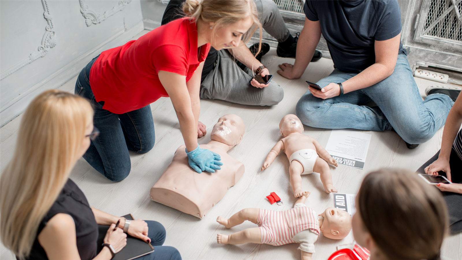 Students practice CPR on medical manikins