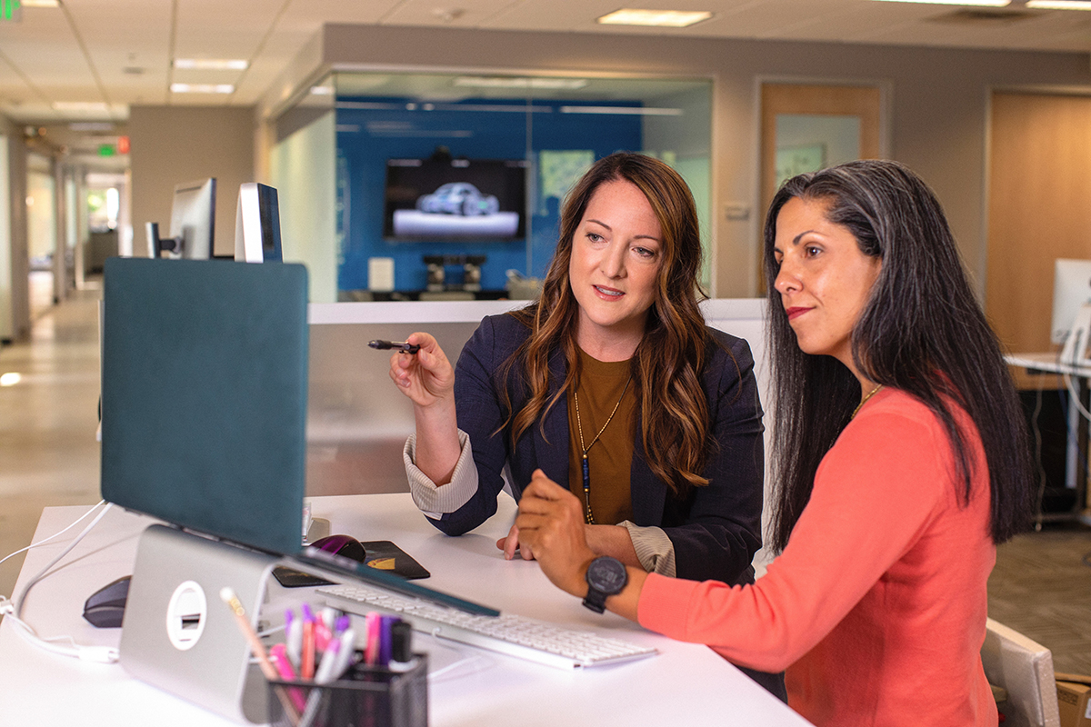 Two businesswomen in discussion at an office